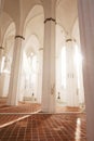 White shining interior of the church - high columns