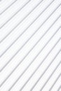 White shiny metal corrugated surface pattern diagonal view