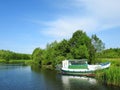 White ship and river, Lithuania Royalty Free Stock Photo