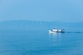 The white ship sails on lake Baikal. Royalty Free Stock Photo