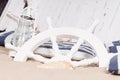 White ships wheel buried in sand Royalty Free Stock Photo