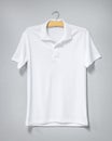White shirt hanging on cement wall. Blank t-shirt for printing. Front view Royalty Free Stock Photo