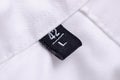 White shirt macro tag size L Royalty Free Stock Photo