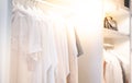 The white shirts hanging on rack in built-in cupboard for neat and clean in the room Royalty Free Stock Photo