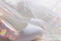 White shoes. wedding shoes. Bride`s high heels. The fees of the bride. Wedding jewelry.