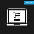 White Shopping cart on screen laptop icon isolated on black background. Concept e-commerce, e-business, online business Royalty Free Stock Photo