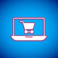 White Shopping cart on screen laptop icon isolated on blue background. Concept e-commerce, e-business, online business Royalty Free Stock Photo