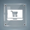 White Shopping cart on screen laptop icon isolated on grey background. Concept e-commerce, e-business, online business Royalty Free Stock Photo