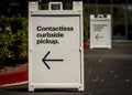 Sign advertising Contactless Curbside Pickup at retail store parking lot Royalty Free Stock Photo