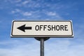 White sign with arrow with offshore. Direction sign. Arrows on a pole pointing in one direction. IT offshoring