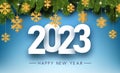 White 2023sign with hanging yellow paper snowflakes