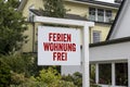 White sign with red letters and the german words for holiday appartment free - Ferienwohnung frei Royalty Free Stock Photo