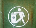 White sign on used green garbage bin Royalty Free Stock Photo