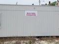 White sign on a white wood wall by the beach that says Beach Patrol Headquarters Royalty Free Stock Photo