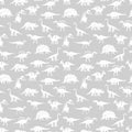 White silhouettes different dinosaurus vector seamless pattern