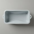 White silicone baking mold with a sleek, rectangular shape and gently rounded edges. Royalty Free Stock Photo