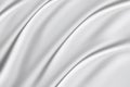 White silk cloth fabric wave overlapping with light and shadow. white and gray abstract texture background