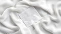 White silk fabric draped with square textile sample Royalty Free Stock Photo