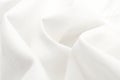 White silk fabric. Texture of white chintz fabric with waves and rumples