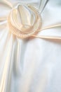 White silk with pearls as wedding background
