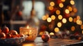 White and silver Candle holder with some red Christmas balls put on an old wood table with a blurry Christmas tree