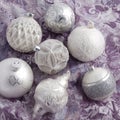 White and silver christmas balls on wrapping paper