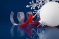 White, silver and red christmas ornaments on dark blue background Royalty Free Stock Photo