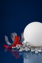 White, silver and red christmas ornaments on dark blue background Royalty Free Stock Photo