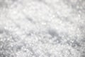 White silvery texture of defocused snow. Bright spotted bokeh