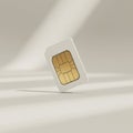 White SIM card with golden chip on simple white background with soft shadows Royalty Free Stock Photo