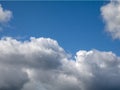 White single clouds over blue sky background. Fluffy cumulus clouds shape