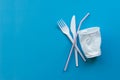 White single-use plastic and plastic drink straws on a blue background. Say no to single use plastic Royalty Free Stock Photo