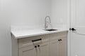 White sink and countertop with a black handle Royalty Free Stock Photo