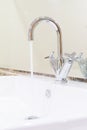 White sink washbasin and silver curve design faucet Royalty Free Stock Photo