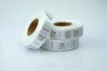 White skeins, a roll of ribbon with information on washing and fabric composition. Royalty Free Stock Photo