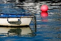 White Skiff With Pink Buoy Royalty Free Stock Photo