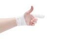 White-skinned hand with bandaged index finger in pointing gesture and wrist, thumb up, isolated on white background