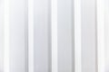 White slatted plastic wall panel. Modern trends in interior design. Space for text