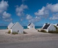 White slave houses on the south side of Bonaire. You can see the Caribbean sea . Royalty Free Stock Photo