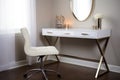 a white, sleek desk with a modern chair and laptop on it