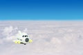 Small airplane toys flying in the sky surrounded with clouds. Royalty Free Stock Photo