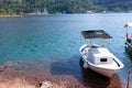White small boat moored on the shore of the sea bay Royalty Free Stock Photo
