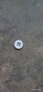 A white small button