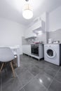 White, small and compact kitchen