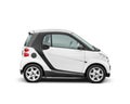 White small 2-occupant city car isolated on white background with clipping path Royalty Free Stock Photo