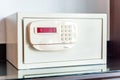 White small safe with coded lock on the table in the hotel Royalty Free Stock Photo