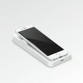 White smartphone placed on a rectangular charging dock, featuring a sleek design