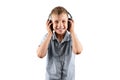White smiling boy listens to music in big headphones Isolated on a white background. Musician, the future of the child, music Royalty Free Stock Photo