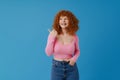 White smiling woman with ginger hair showing thumb up at camera Royalty Free Stock Photo