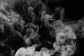 White smoke on a black background. Texture of smoke. Clubs of wh